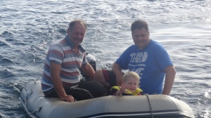 With Daddy and Grandad in the dinghy